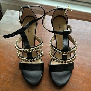 G.I.L.I. Women’s black high heels with gold chains. New; Never worn. Size 7.5